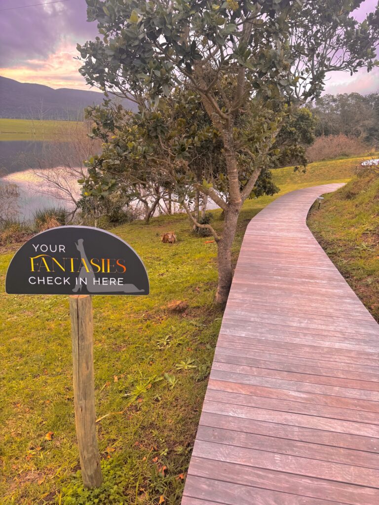 Boardwalk and arrival sign at Naughty by Nature, Hoekwil, Wilderness