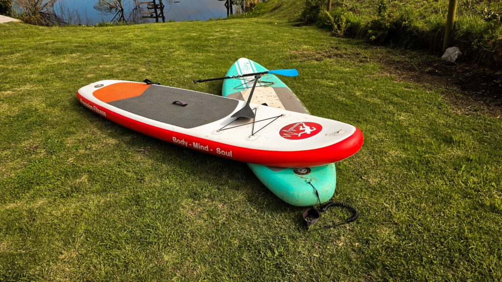 Paddleboards by the lake at Naughty by Nature, Wilderness